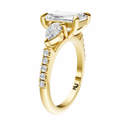 Emerald Accented Three Stone Pear Setting
