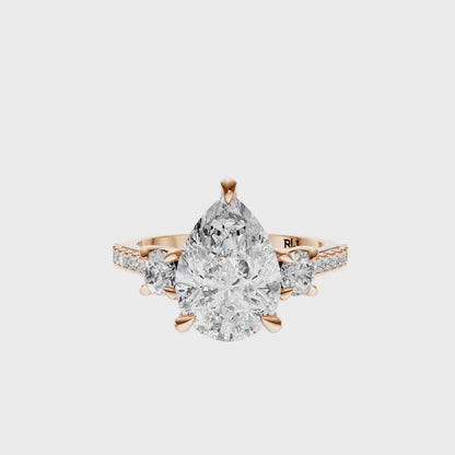 Pear Accented Three Stone Round Setting