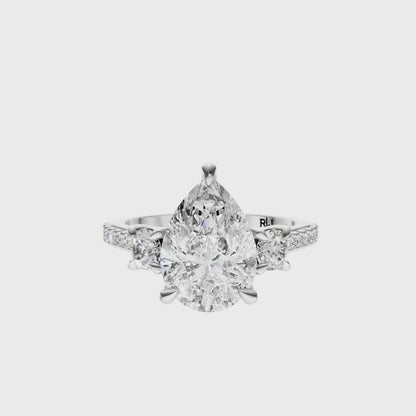 Pear Accented Three Stone Round Setting