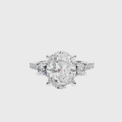 Oval Accented Three Stone Round Setting